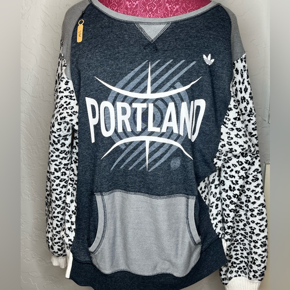 Upcycled Portland Trailblazer print with soft leopard print sweater sleeve.